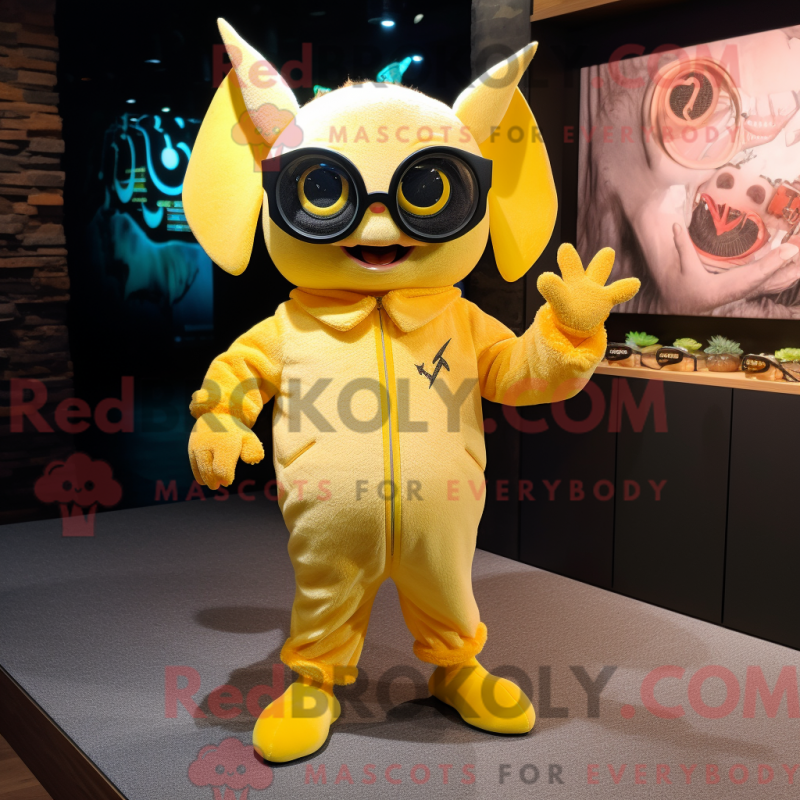 Mascot character of a Lemon Yellow Bat dressed with a Jumpsuit and Eyeglasses Mascot character of a Lemon Yellow Bat dressed with a Jumpsuit and Eyeglasses
