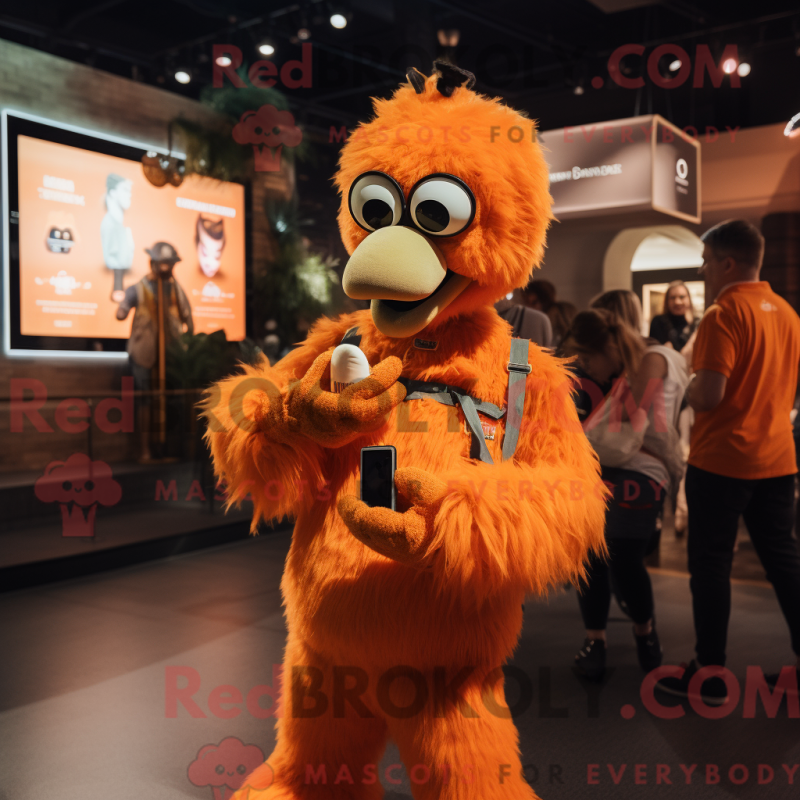 Mascot character of a Orange Ostrich dressed with a Overalls and Smartwatches Mascot character of a Orange Ostrich dressed with a Overalls and Smartwatches