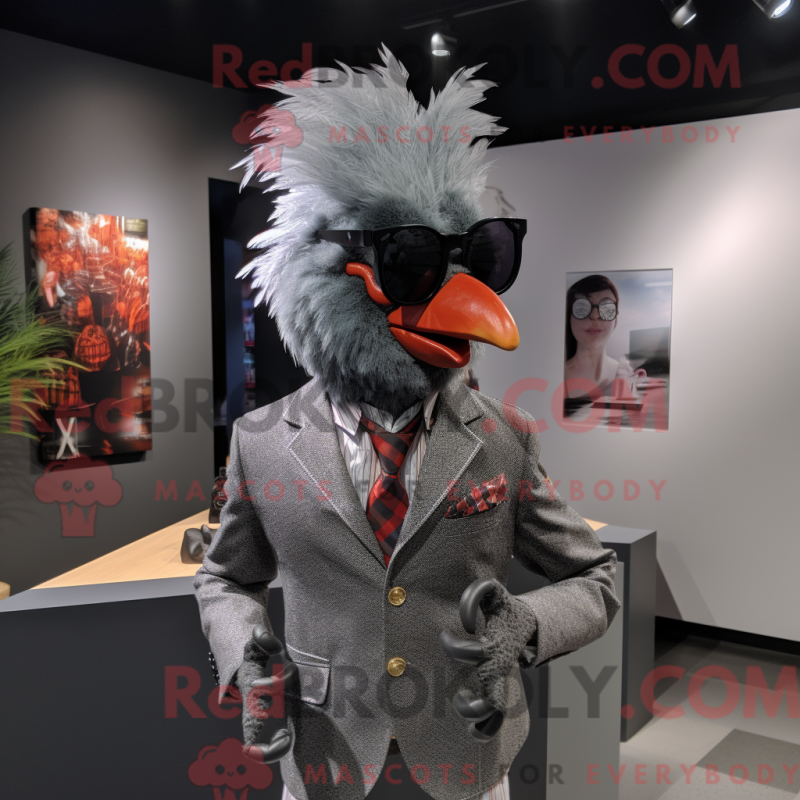 Mascot character of a Gray Rooster dressed with a Blazer and Sunglasses Mascot character of a Gray Rooster dressed with a Blazer and Sunglasses