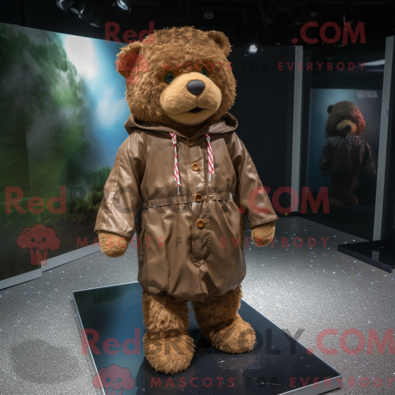Mascot character of a Brown Teddy Bear dressed with a Raincoat and Cummerbunds Mascot character of a Brown Teddy Bear dressed with a Raincoat and Cummerbunds