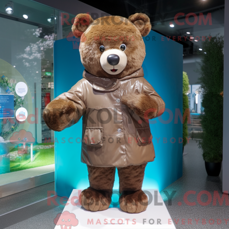 Mascot character of a Brown Teddy Bear dressed with a Raincoat and Cummerbunds Mascot character of a Brown Teddy Bear dressed with a Raincoat and Cummerbunds