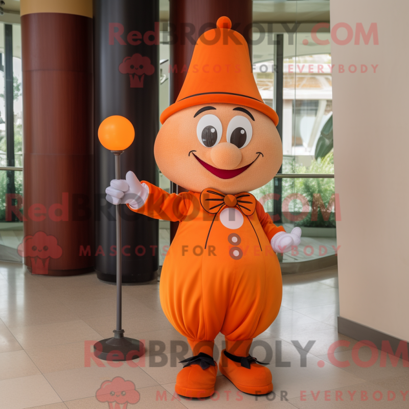 Mascot character of a Orange Magician dressed with a Chinos and Keychains Mascot character of a Orange Magician dressed with a Chinos and Keychains