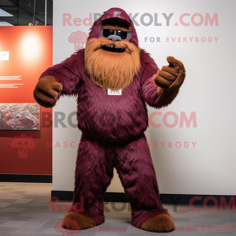 Mascot character of a Maroon Sasquatch dressed with a Trousers and Beanies Mascot character of a Maroon Sasquatch dressed with a Trousers and Beanies