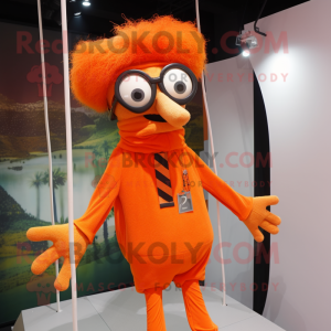 Orange Trapeze Artist mascot costume character dressed with a Cover-up and Eyeglasses