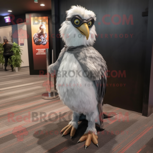 Silver Haast'S Eagle mascot costume character dressed with a Evening Gown and Eyeglasses