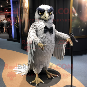 Silver Haast'S Eagle mascot costume character dressed with a Evening Gown and Eyeglasses