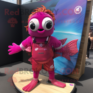 Magenta Goldfish mascot costume character dressed with a Board Shorts and Rings