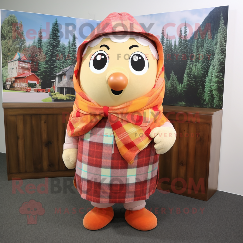 Peach Goulash mascot costume character dressed with a Flannel Shirt and Shawls