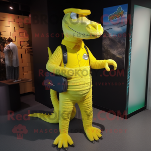 Yellow Crocodile mascot costume character dressed with a Jeggings and Clutch bags