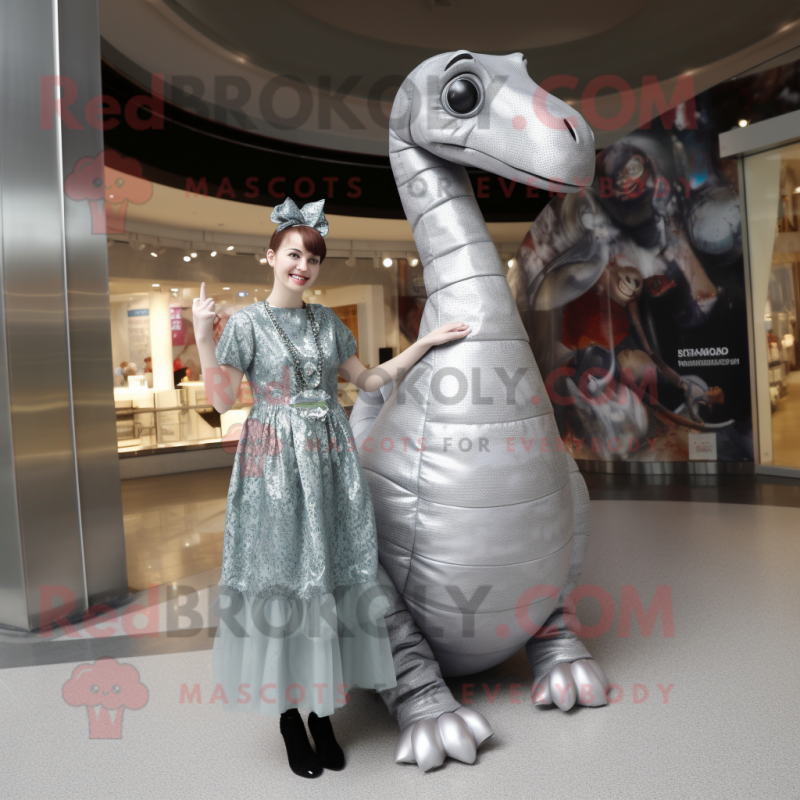 Silver Diplodocus mascot costume character dressed with a Mini Dress and Wraps Silver Diplodocus mascot costume character dressed with a Mini Dress and Wraps