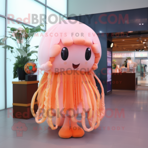 Peach Jellyfish mascot costume character dressed with a Blouse and Keychains