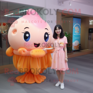 Peach Jellyfish mascot costume character dressed with a Blouse and Keychains