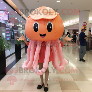 Peach Jellyfish mascot costume character dressed with a Blouse and Keychains