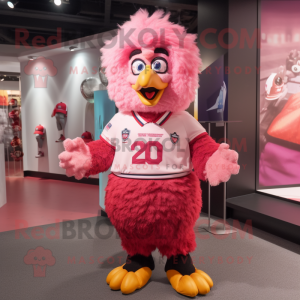 Pink Fried Chicken mascot costume character dressed with a Rugby Shirt and Shawl pins