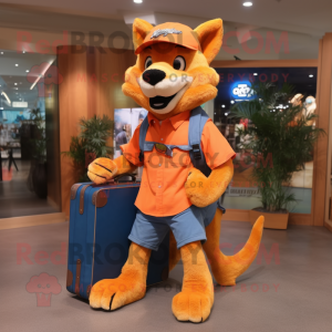 Orange Dingo mascot costume character dressed with a Denim Shorts and Messenger bags