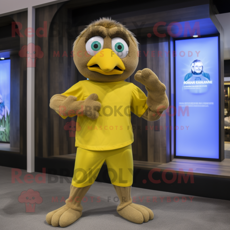 Tan Canary mascot costume character dressed with a Yoga Pants and Gloves