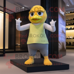 Tan Canary mascot costume character dressed with a Yoga Pants and Gloves