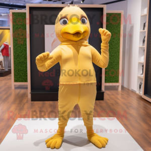 Tan Canary mascot costume character dressed with a Yoga Pants and Gloves