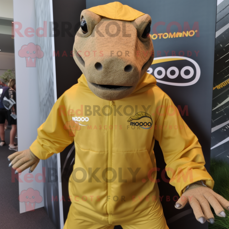 Gold Komodo Dragon mascot costume character dressed with a Windbreaker and Headbands Gold Komodo Dragon mascot costume character dressed with a Windbreaker and Headbands