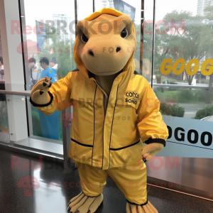 Gold Komodo Dragon mascot costume character dressed with a Windbreaker and Headbands