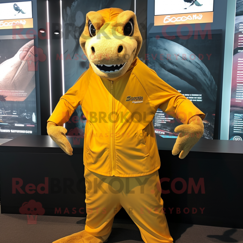 Gold Komodo Dragon mascot costume character dressed with a Windbreaker and Headbands