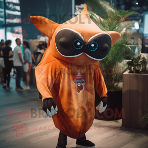 Rust Manta Ray mascot costume character dressed with a Joggers and Eyeglasses