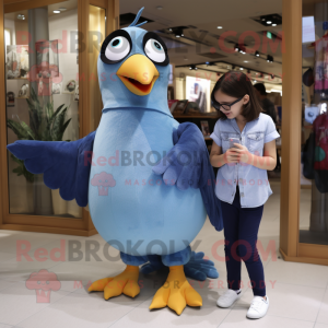 Blue Pigeon mascot costume character dressed with a Mom Jeans and Keychains