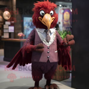 Maroon Harpy mascot costume character dressed with a Waistcoat and Tie pins