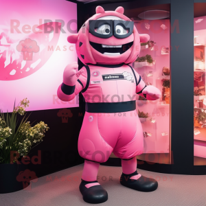 Pink Rugby Ball mascot costume character dressed with a Jumpsuit and Rings