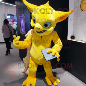 Yellow Gargoyle mascot costume character dressed with a Leggings and Messenger bags
