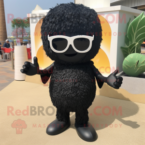 Black Fried Rice mascot costume character dressed with a Playsuit and Sunglasses