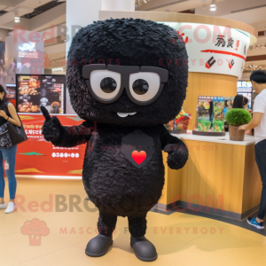 Black Fried Rice mascot costume character dressed with a Playsuit and Sunglasses