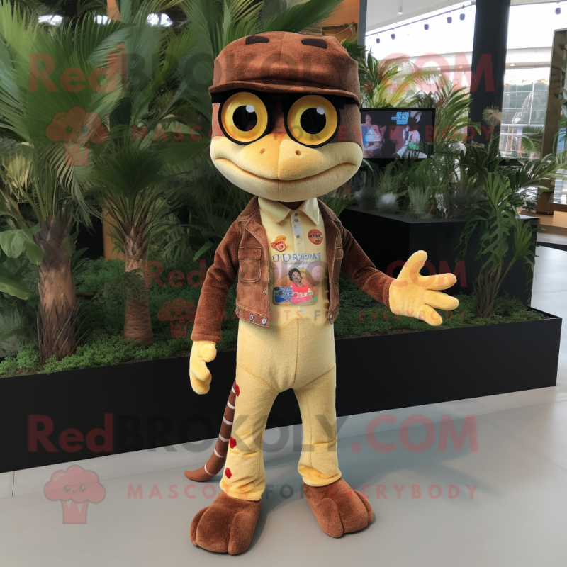Brown Geckos mascot costume character dressed with a Flare Jeans and Eyeglasses Brown Geckos mascot costume character dressed with a Flare Jeans and Eyeglasses