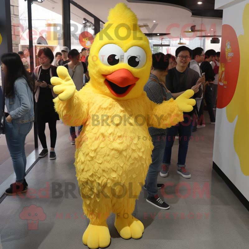 Yellow Fried Chicken mascot costume character dressed with a Boyfriend Jeans and Foot pads Yellow Fried Chicken mascot costume character dressed with a Boyfriend Jeans and Foot pads