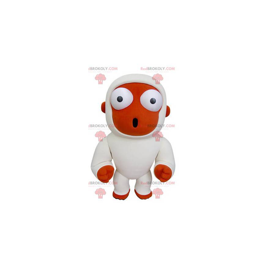 Mascote macaco laranja e branco parecendo surpreso -
