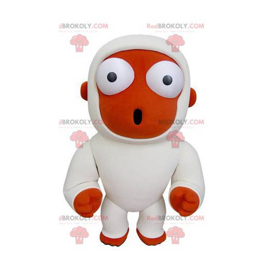 Mascote macaco laranja e branco parecendo surpreso -