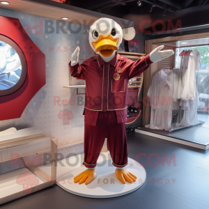 Maroon Muscovy Duck mascot costume character dressed with a Jumpsuit and Shoe clips