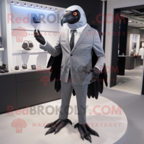 Gray Crow mascot costume character dressed with a Blazer and Smartwatches