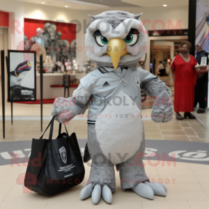 Silver Hawk mascot costume character dressed with a Polo Tee and Tote bags