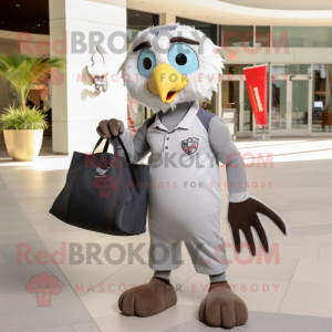 Silver Hawk mascot costume character dressed with a Polo Tee and Tote bags