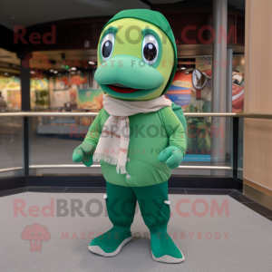 Green Salmon mascot costume character dressed with a Polo Shirt and Shawl pins