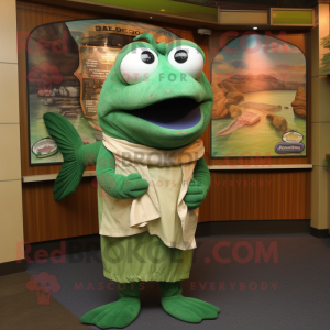 Green Salmon mascot costume character dressed with a Polo Shirt and Shawl pins