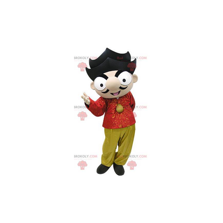 Mascotte ragazzo marrone con vestito rosso e giallo -