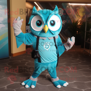 Turquoise Owl mascot costume character dressed with a Jumpsuit and Suspenders
