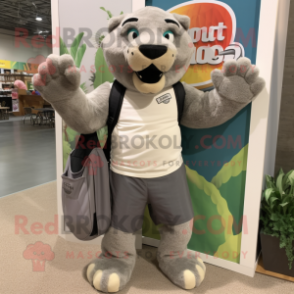 Gray Smilodon mascot costume character dressed with a Board Shorts and Tote bags