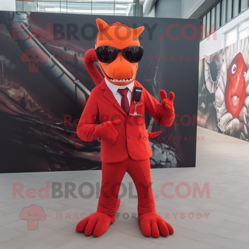 Red Hydra mascot costume character dressed with a Suit and Eyeglasses