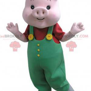 Mascotte de cochon rose avec une salopette verte -