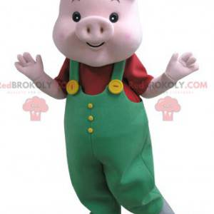 Roze varken mascotte met groene overall - Redbrokoly.com