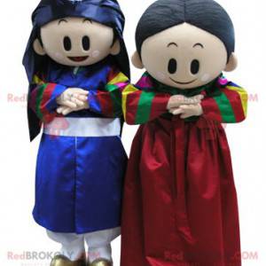 2 mascotte di un ragazzo e una ragazza in abito colorato -