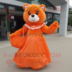 Orange Teddy Bear mascot costume character dressed with a Ball Gown and Tote bags